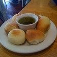 The bread with olive oil.